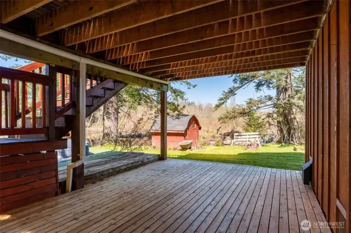 Bottom deck  freshly powered washed. And there is a shed or chicken coop right there for your use!
