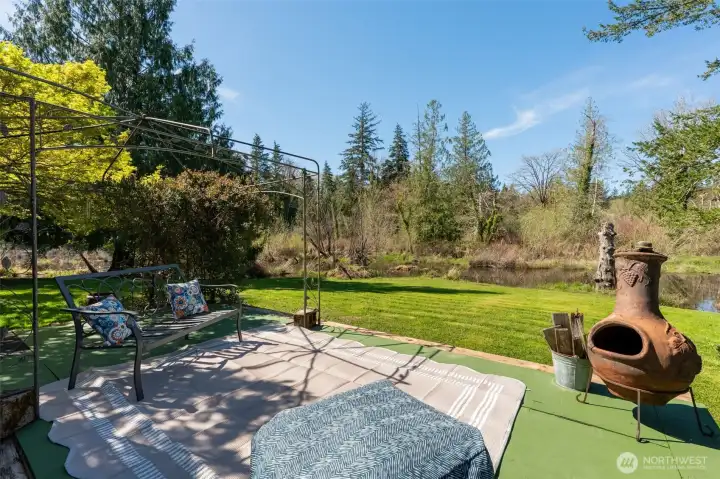 Lower deck off of back uncovered ready for your quiet enjoyment of nature. You will see ducks and geese from time to time pass by on the creek sitting beyond your yard.