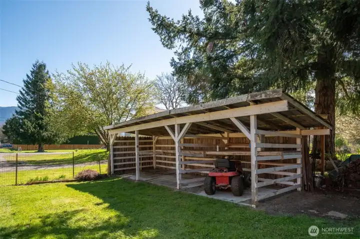 Small storage area on south side of home - great news! You already have a riding lawn mower (mower conveys with home)
