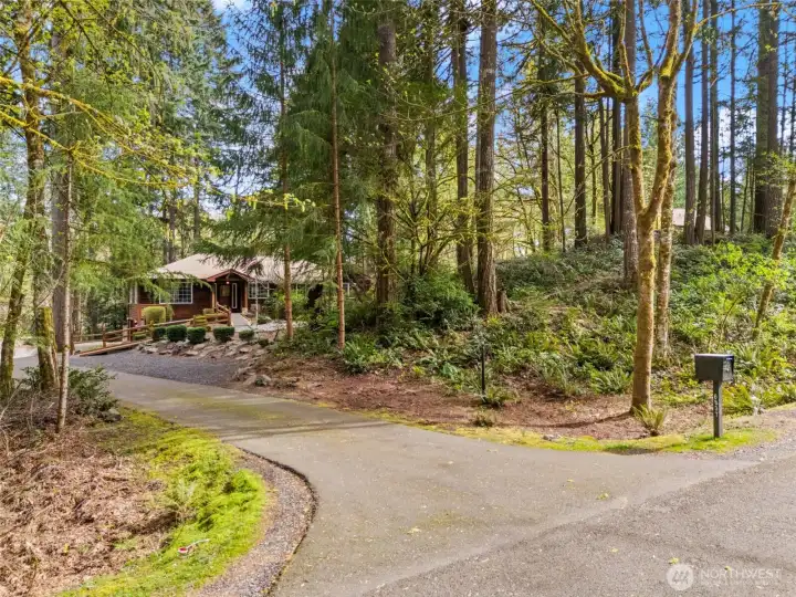 The peaceful setting offers good off street parking and natural treed privacy.