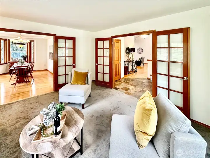 This shows the access from both the entry and dining into the living room.  In this photo you also see the entry and short hall that leads to the family room.