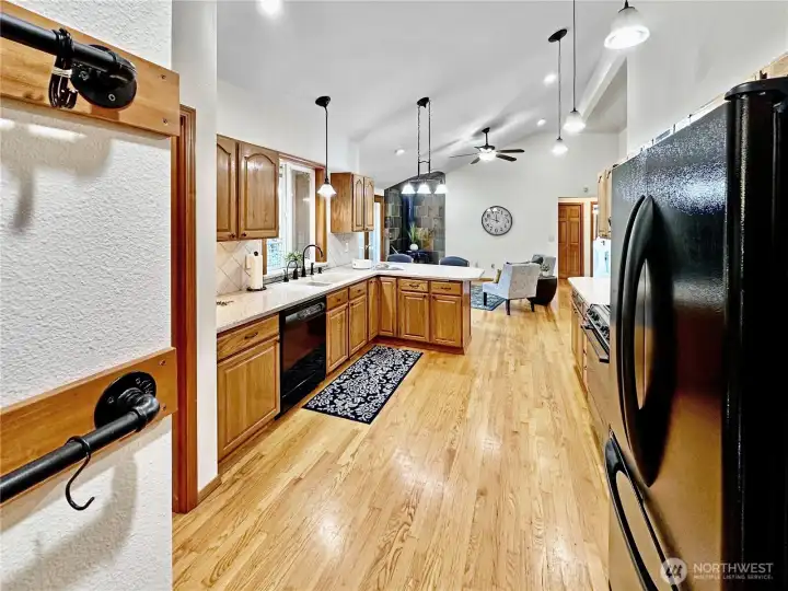 Vaulted kitchen...on the left wall in this photo are racks for your cookware, notice the ample lighting with both can and pendent lighting.