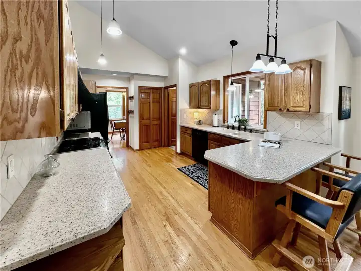 Loads of kitchen cabinets plus pantry closet and easy access to the main floor laundry room with door to the rear patio.