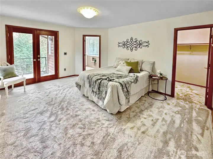 Ample primary bedroom with walk-in closet, French door access to the rear deck and private 3/4 bath.