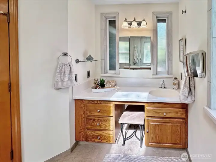 Primary bath vanity...there is also a separate water closet behind barn-style door for privacy.