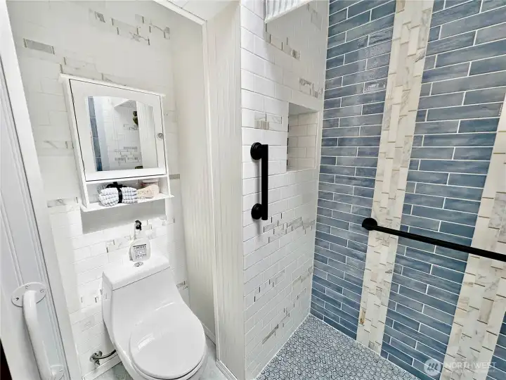 Update Hall 3/4 guest bath with beautiful full tile shower.