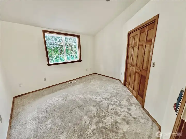 Main floor 3rd bedroom or den.  Fresh paint and brand new carpets.