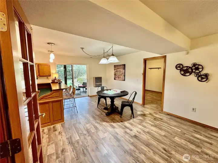 Another view...looking toward the slider and bar area where there is a sink making it perfect for entertaining or family overflow.
