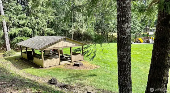 Community park with covered picnic cabana and play equipment area. The development also offers walking trails. Community park with covered picnic cabana and play equipment area. The development also offers walking trails.