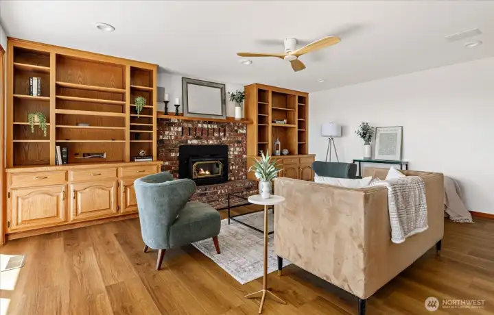 Another view of the family room shows the wood-burning fireplace
