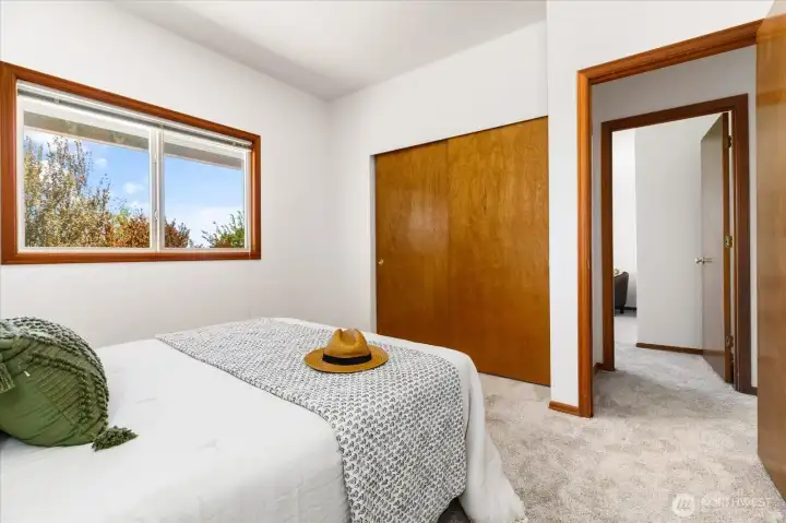 Bedroom 1 showing closet at left and door to hall at right
