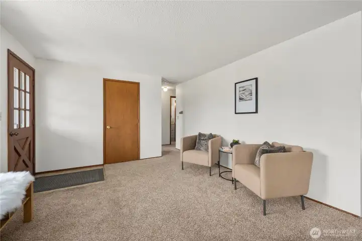 Entryway opens to a warm and welcoming living room.