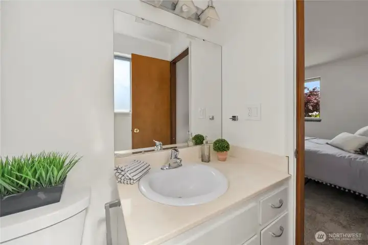 Convenient half bath located just off the primary suite.