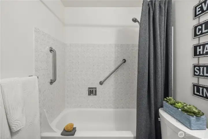 Bathroom features a tub/shower combination.
