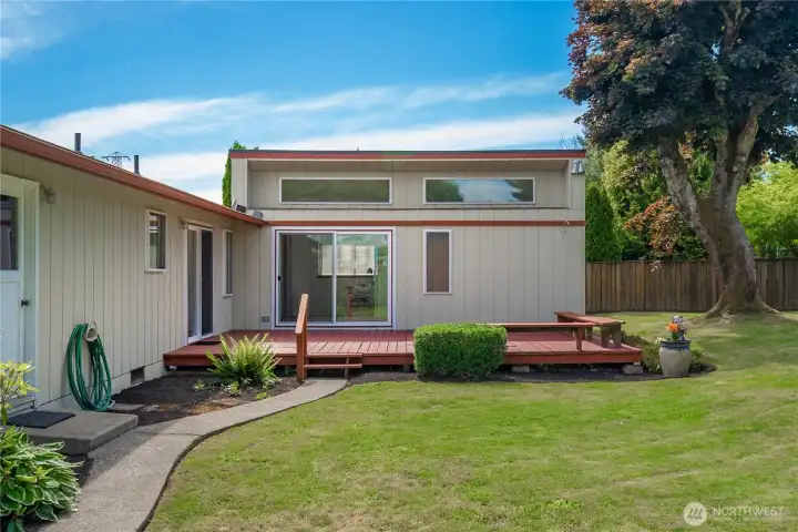 Paved walkway provides easy access to RV parking and side yard.