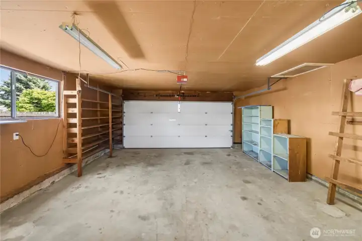 Spacious 2-car garage with generous storage and convenient laundry area.