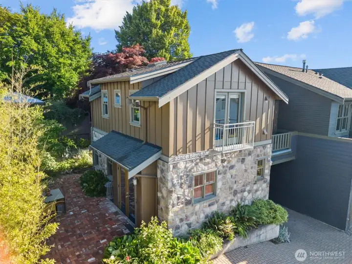 The ADU is an adorable space with stone siding.