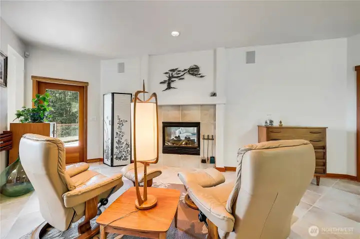 Primary bedroom with double-sided fireplace insert.