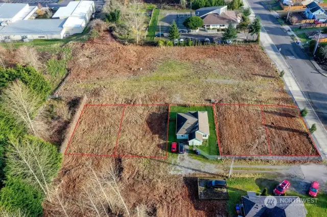 4 lots on West side of E N Street. House not included. Lots are 2 to the left and 2 to the right of the house.  (Red boundary lines are for visual purposes only)