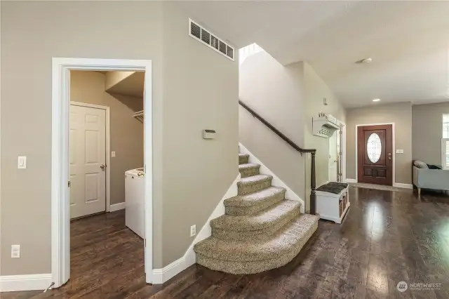 Staircase, Laundry, and Garage Door