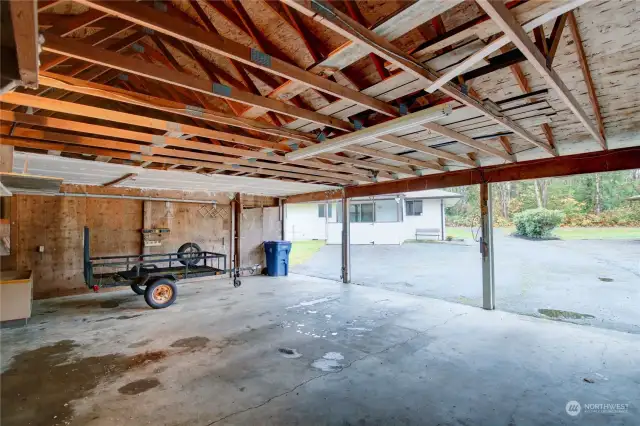 Sliding door opens to a big workshop the full width of the building