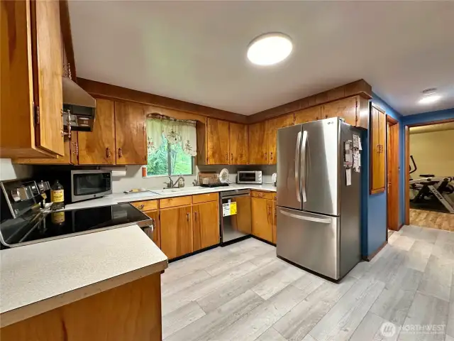 New flooring, stove and dishwasher.