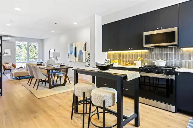 This open-concept layout keeps everyone connected — from kitchen prep to dinner to movie nights in the living room.