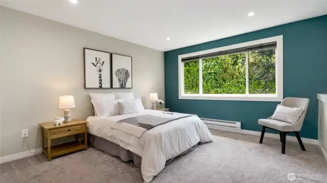 Primary bedroom. Efficient baseboard heaters with Smart programable thermostat.