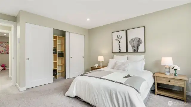Primary bedroom showing large closet with built-ins