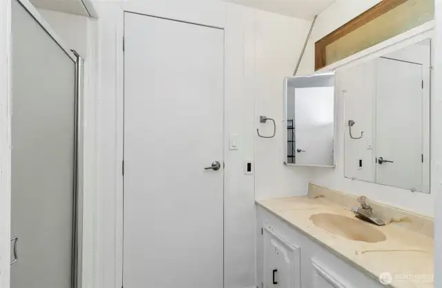 Bathroom with closet storage