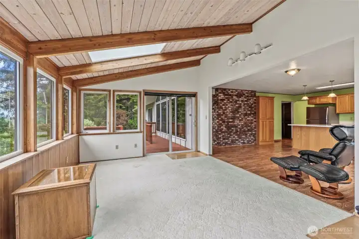 Skylights, tons of windows and slider to back deck w/steps to lawn from this lovely sunroom.