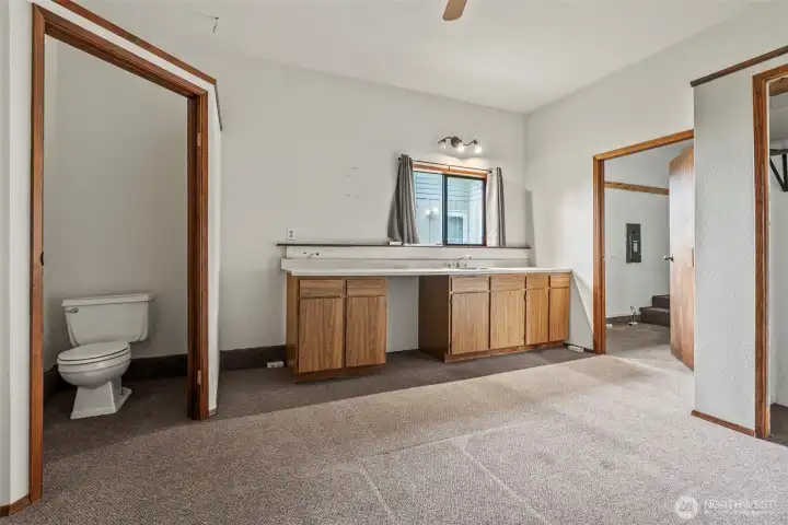 Partial bath, kitchenette ready for under counter refrigerator.