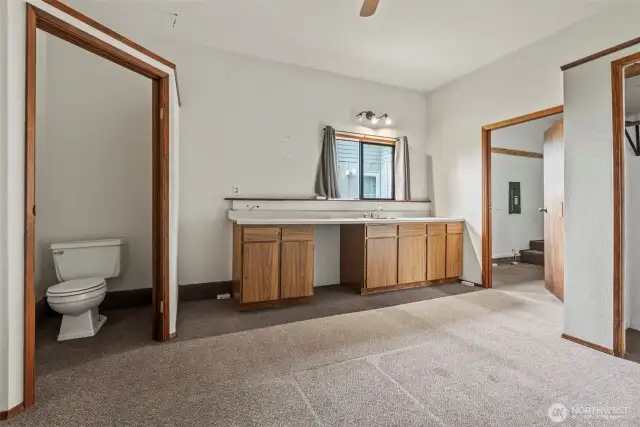 Partial bath, kitchenette ready for under counter refrigerator.