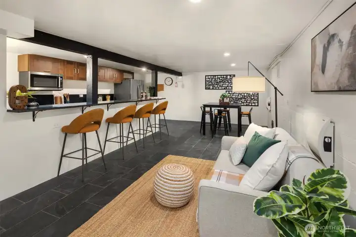 Lower level living space with a full kitchen, sitting area and dining room