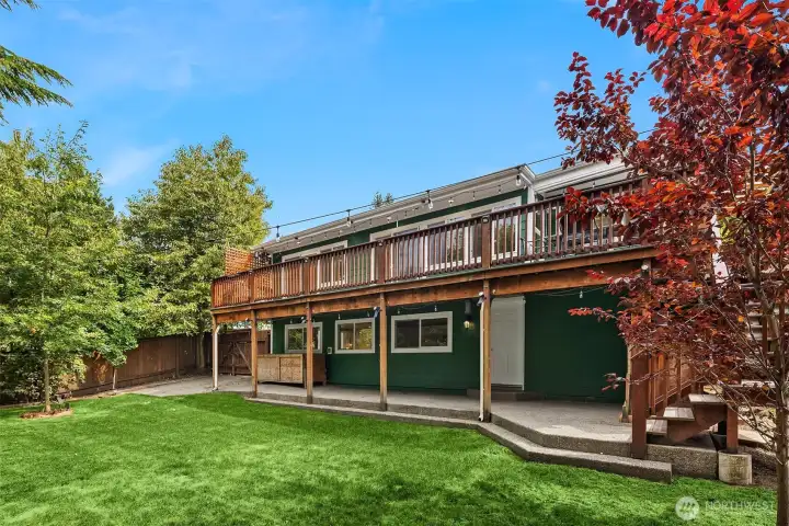 Lovely, level rear yard with plenty of patio, lawn & garden space