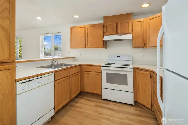 Lots of storage in the kitchen and a well laid of floor plan with an eat at bar