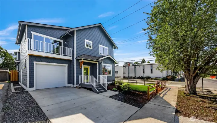 Main house two car tandem garage w/ EV