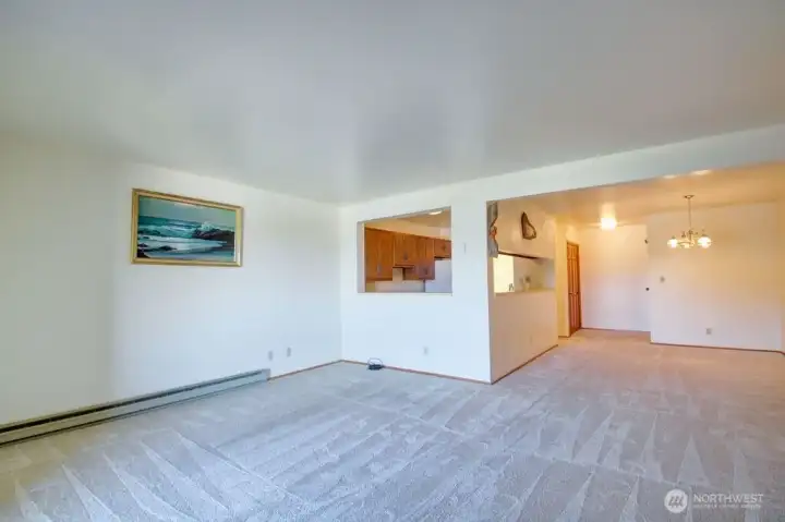 Living room with view of kitchen and dining area.