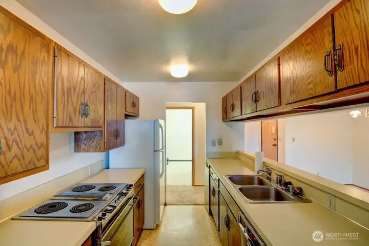 Kitchen looking towards hallway and across to the utility room.