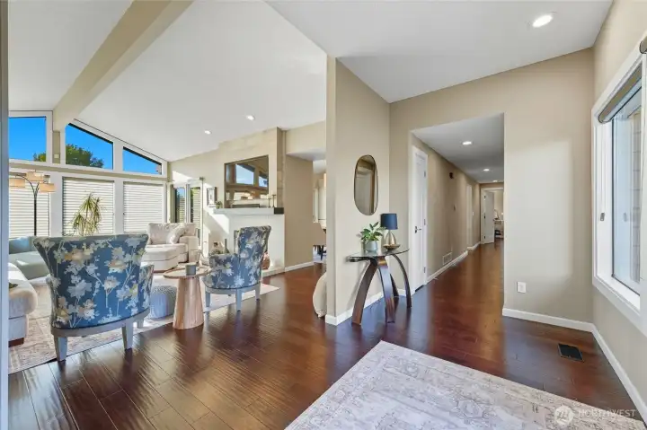 entrance looking into living room and down hallway that leads to bedrooms