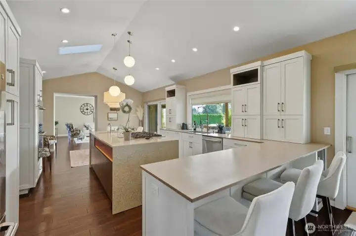 Bar w/stools and island - facing eating area attached to kitchen