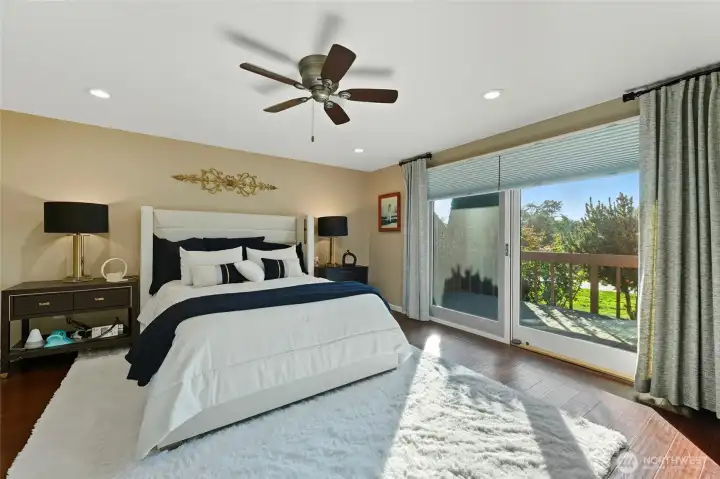 Primary bedroom w/door out to private deck on the right