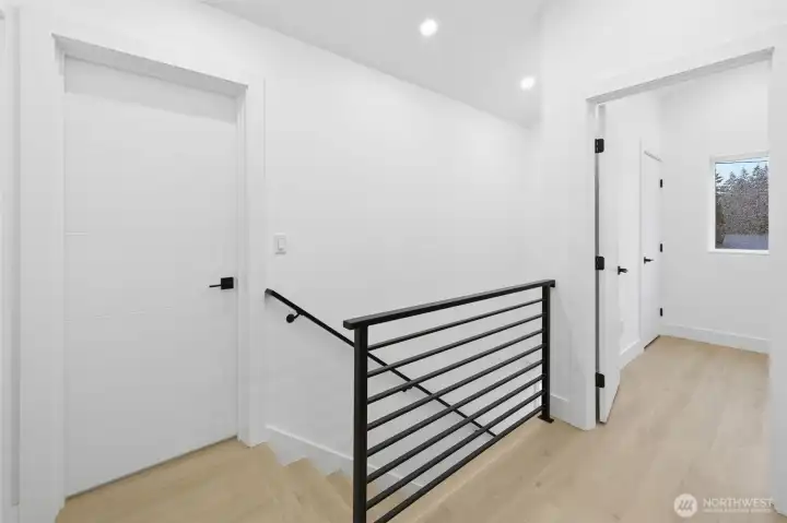 Upstairs, all bedrooms feature vaulted ceilings.