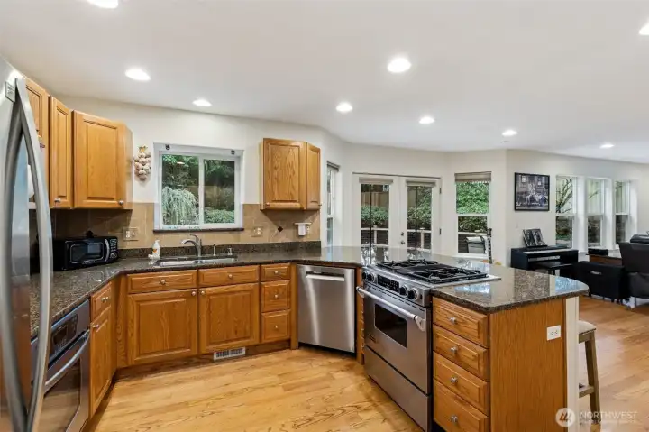 Kitchen with Granite countertops and solid wood cabinets