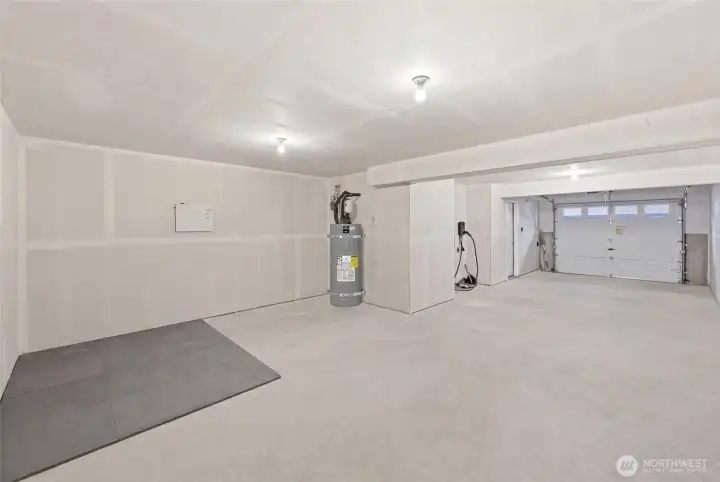 Huge tandem garage with EV plug & space for storage, exercise or workbench.