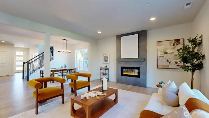 Open the front door pass by the stairs, formal dining area, and into the living room.