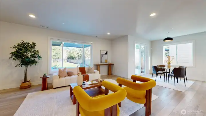 Living room and eating space with slider out to deck.