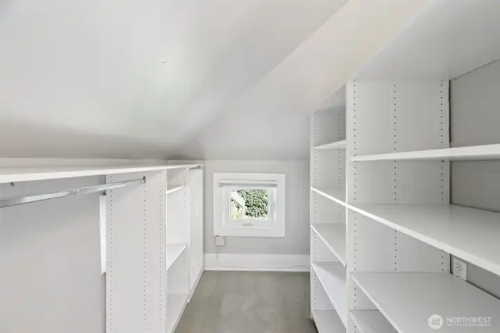 plumbing for washer/dryer behind shelves to the right