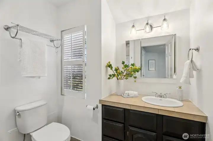 three-quarter bath attached to primary bedroom (shower behind)