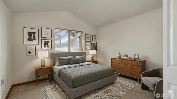 Second bedroom with vaulted ceilings. Virtually staged